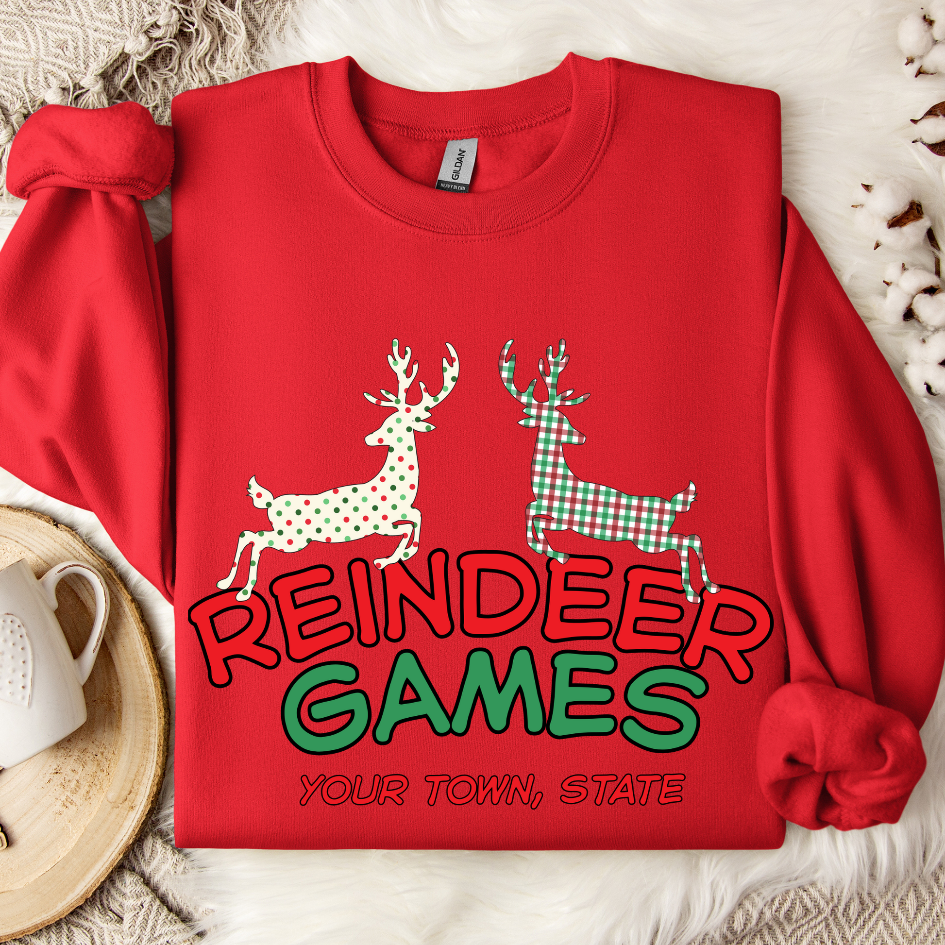 red sweatshirt with 'Reindeer Games' with a red and green plaid reindeer and a polka dot christmas color reindeer.  below image you can customize with your business name, city and state or both