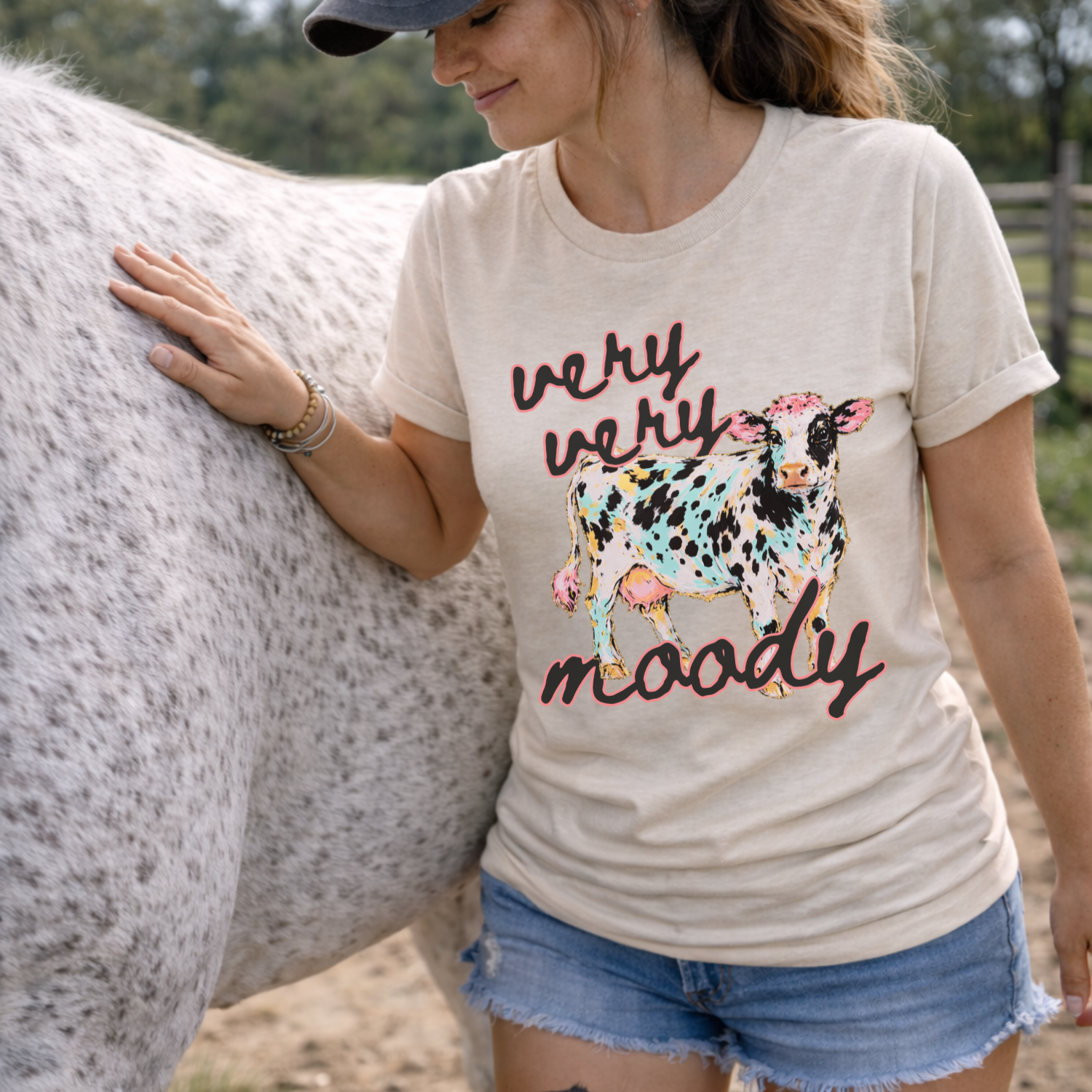 Very Very Moody farm cow graphic on a bella canvas heather oatmeal t-shirt