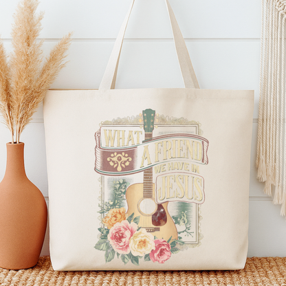 Tote bag with guitar and floral design on a neutral background.  What a friend we have in Jesus