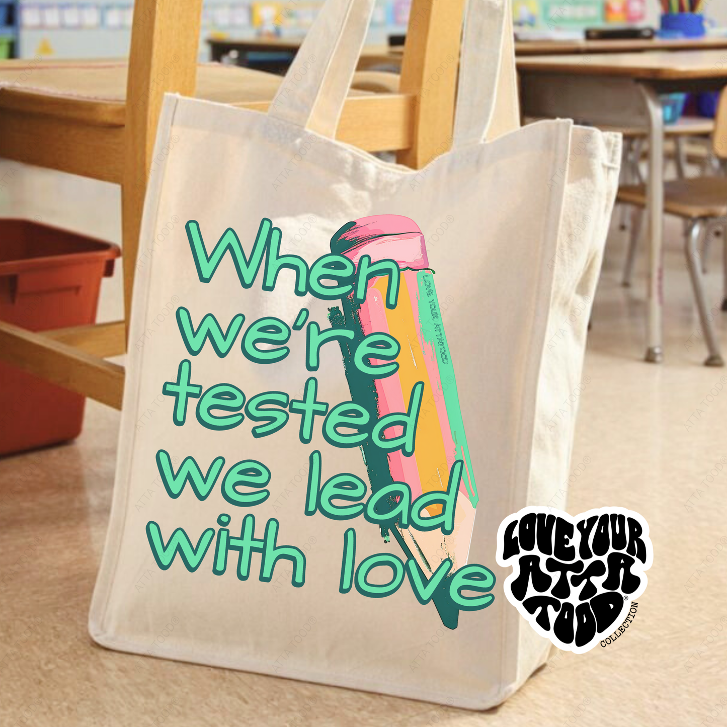 Tote bag with motivational quote and colorful pencil design in a classroom setting
