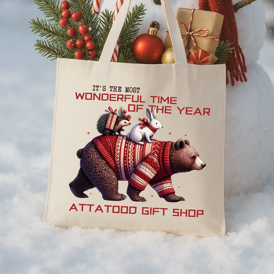 Beige tote bag with Christmas design featuring a bear, a porcupine and a rabbit, text 'It's the most wonderful time of the year.  Personalize it